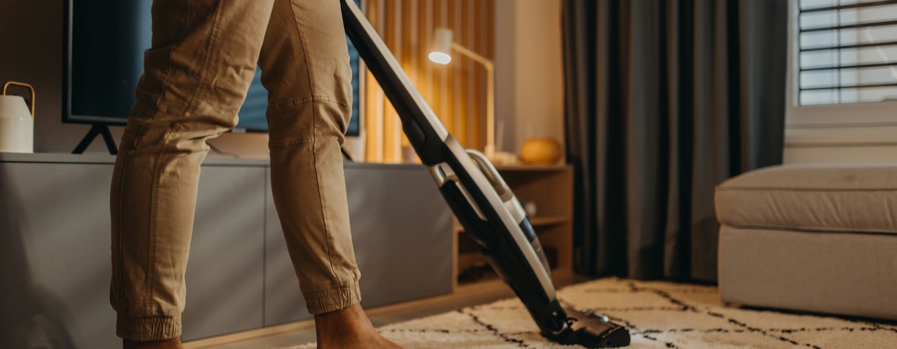 a person holding a vacuum